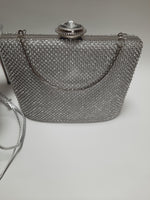Silver glittering fashionable silver clutch for wedding brides and parties with handle and chain for over the shoulder