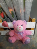 Teddy Bear with holding heart in hand symbol of love