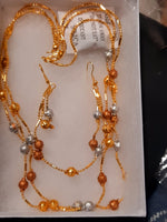 Golden jewelry set with beaded golden beads